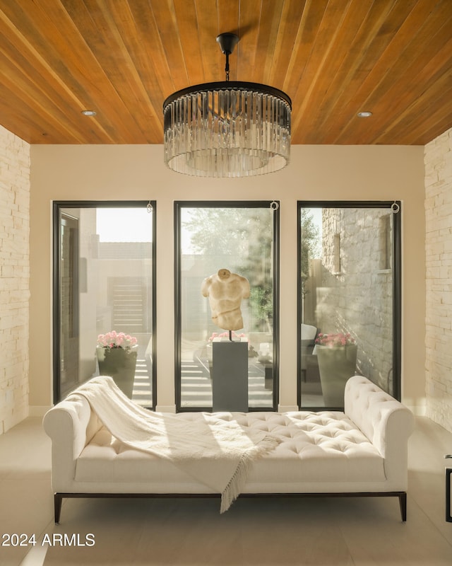 living area featuring wood ceiling and a wealth of natural light