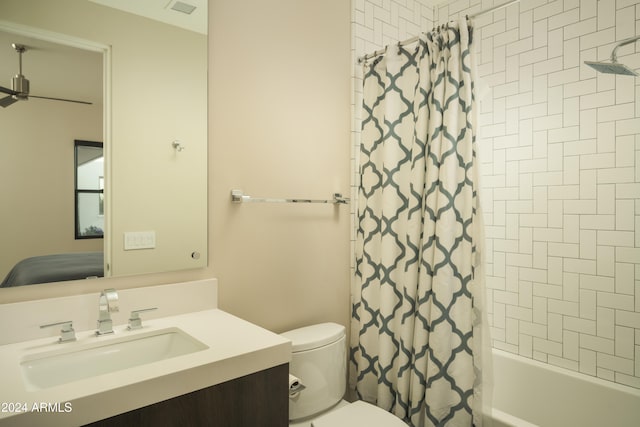 full bathroom featuring vanity, shower / bath combination with curtain, and toilet