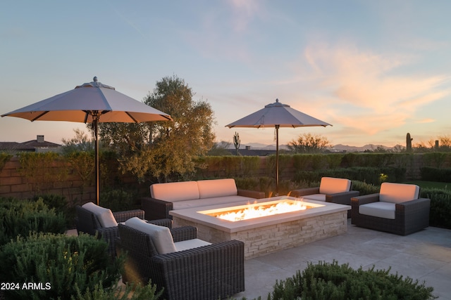 patio terrace at dusk with a fire pit