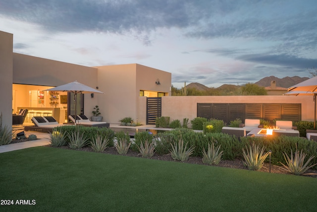 exterior space with a patio and a fire pit