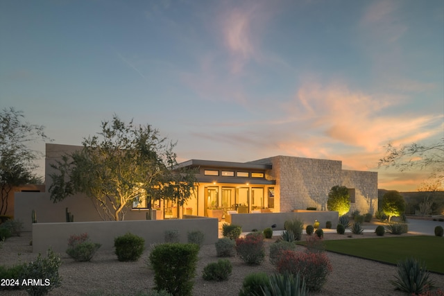 view of front of house with a lawn