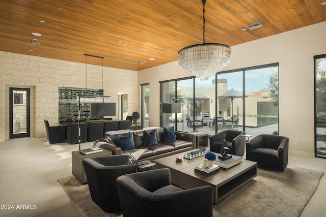 tiled living room featuring a chandelier and wooden ceiling