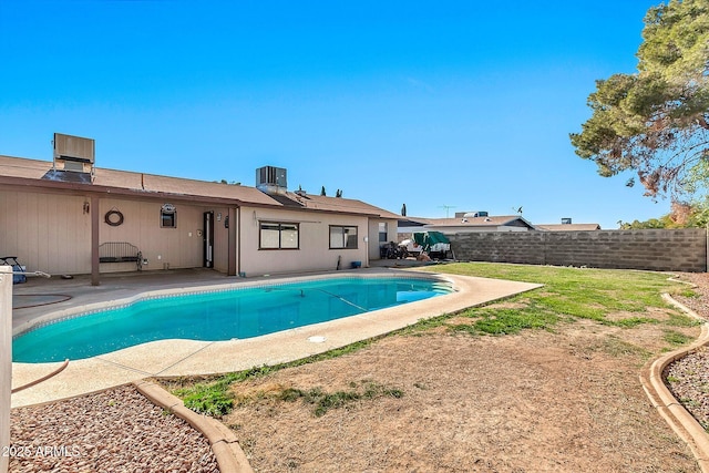 view of pool featuring central AC unit and a patio area