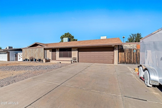 single story home featuring a garage