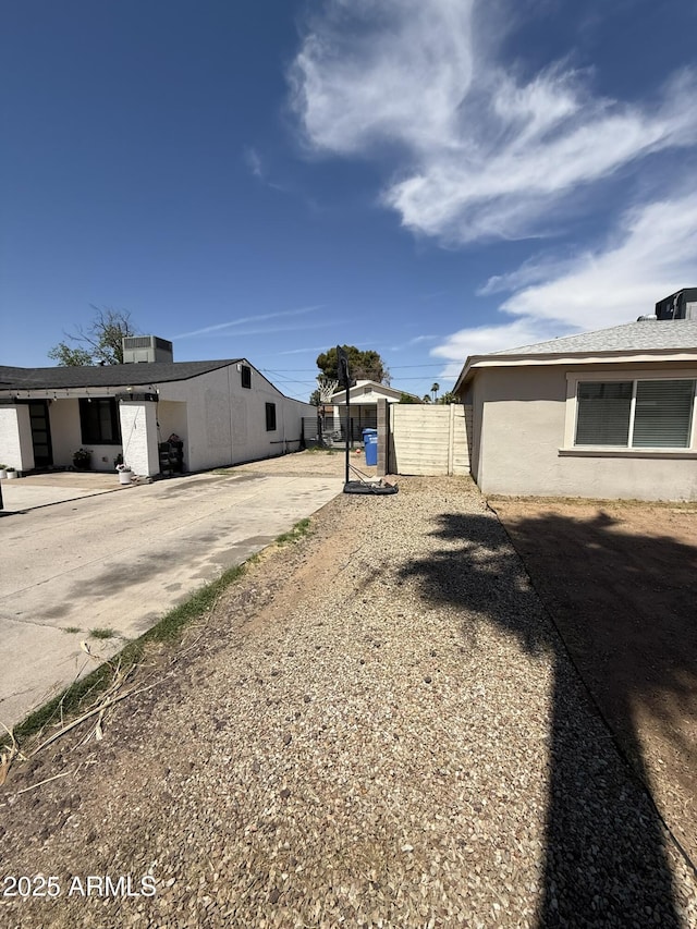 view of yard featuring fence and a gate