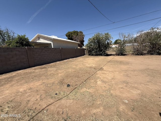 view of yard with fence