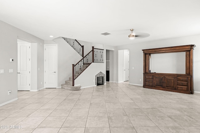 18740 W San Juan Ave, Litchfield Park, AZ 85340 - unfurnished living room featuring stairs, baseboards, and light tile patterned floors