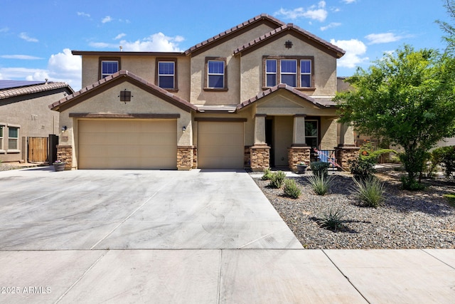 18740 W San Juan Ave, Litchfield Park, AZ 85340 - view of front of house with stucco siding, driveway, a porch, and stone siding