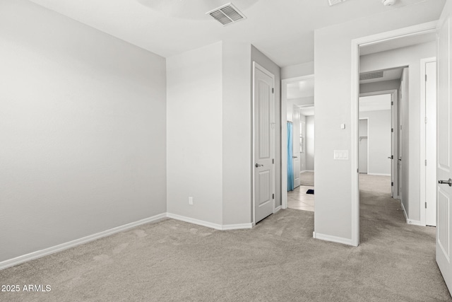 18740 W San Juan Ave, Litchfield Park, AZ 85340 - unfurnished bedroom with light colored carpet and baseboards