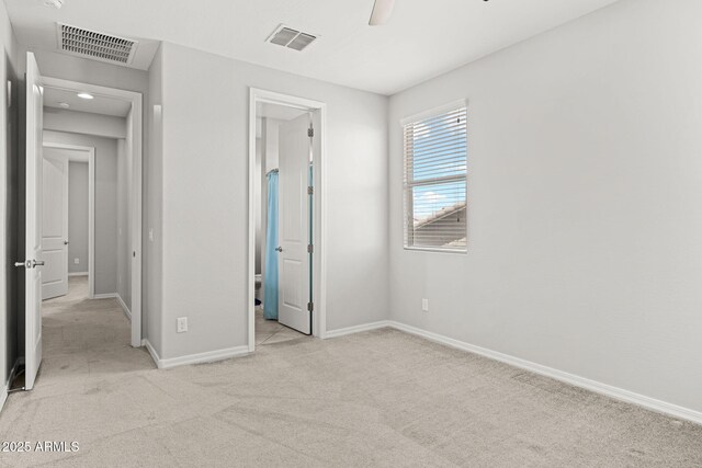 18740 W San Juan Ave, Litchfield Park, AZ 85340 - unfurnished bedroom with light carpet and baseboards