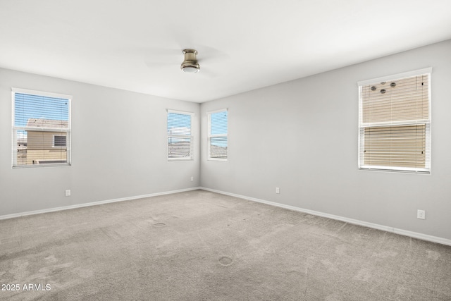 18740 W San Juan Ave, Litchfield Park, AZ 85340 - empty room with a ceiling fan, carpet, and healthy amount of natural light