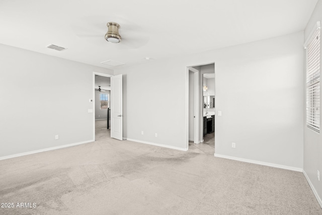 18740 W San Juan Ave, Litchfield Park, AZ 85340 - unfurnished bedroom featuring light colored carpet, baseboards, a ceiling fan, and ensuite bath