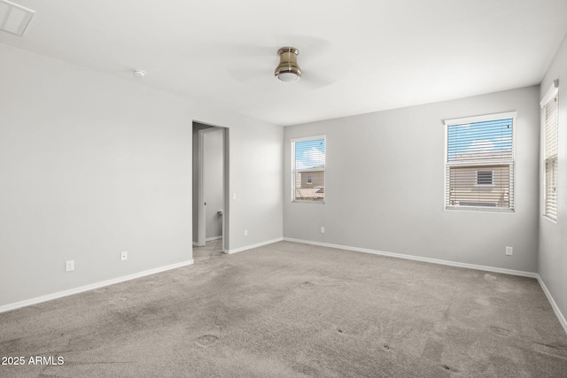 18740 W San Juan Ave, Litchfield Park, AZ 85340 - carpeted spare room with ceiling fan, healthy amount of natural light, baseboards, and a smoke detector