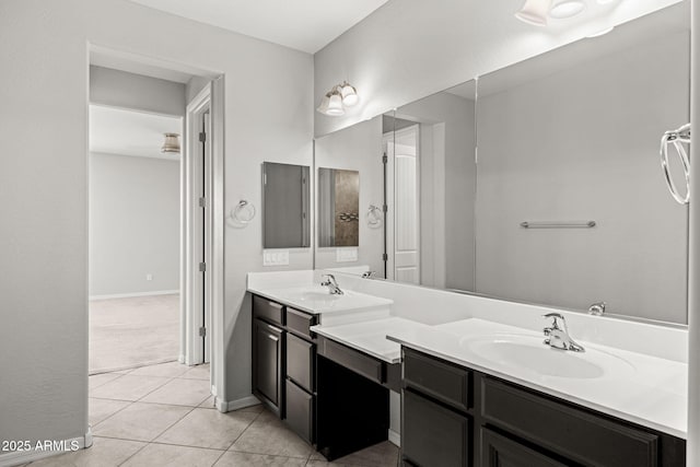 18740 W San Juan Ave, Litchfield Park, AZ 85340 - bathroom featuring double vanity, tile patterned flooring, and baseboards