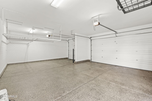 18740 W San Juan Ave, Litchfield Park, AZ 85340 - garage featuring baseboards and a garage door opener