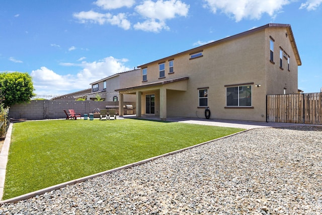 18740 W San Juan Ave, Litchfield Park, AZ 85340 - back of property with stucco siding and a patio area