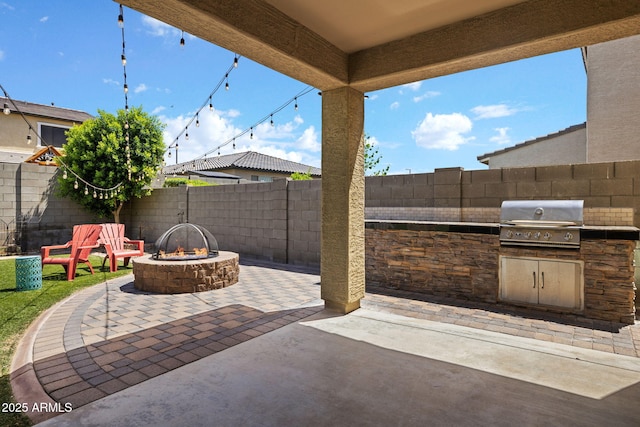 18740 W San Juan Ave, Litchfield Park, AZ 85340 - fenced backyard with a patio area and a fire pit