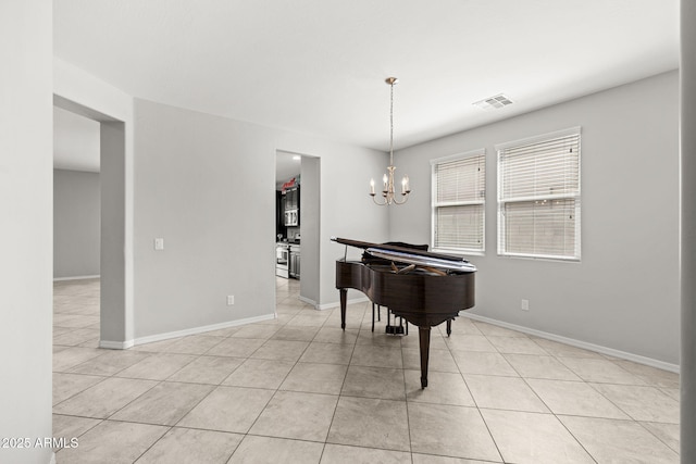 18740 W San Juan Ave, Litchfield Park, AZ 85340 - game room with light tile patterned floors, a chandelier, and baseboards