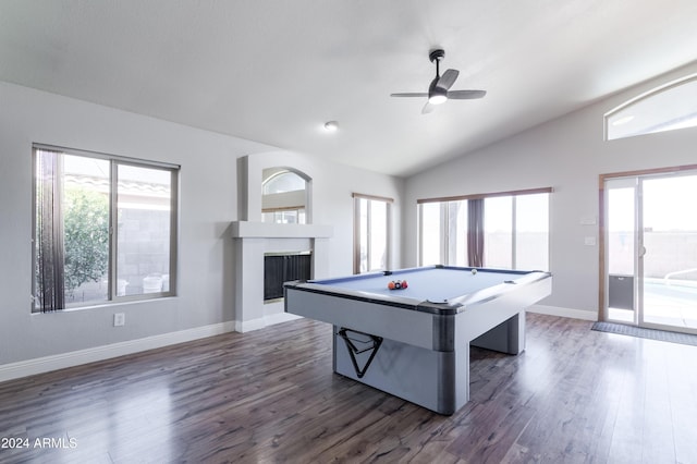 recreation room with plenty of natural light, dark wood finished floors, a fireplace, and vaulted ceiling