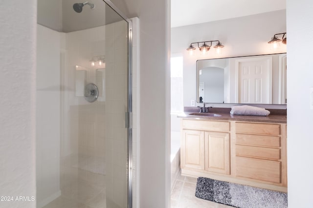 full bath featuring a stall shower and vanity