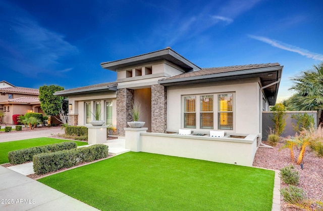 view of front of home with a front lawn