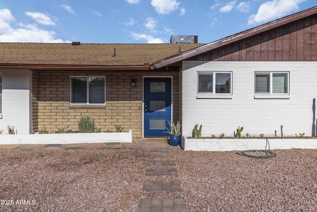 224 N 58th St, Mesa, AZ 85205 - entrance to property featuring a shingled roof and brick siding