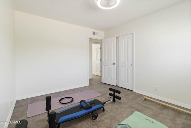 224 N 58th St, Mesa, AZ 85205 - exercise room with baseboards and tile patterned flooring