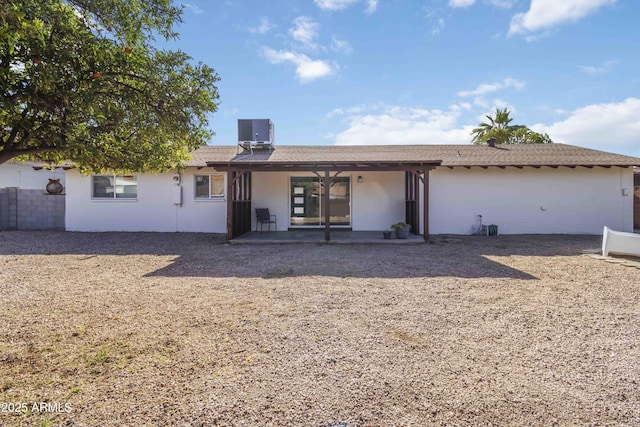 224 N 58th St, Mesa, AZ 85205 - back of house featuring a patio, central AC, and stucco siding