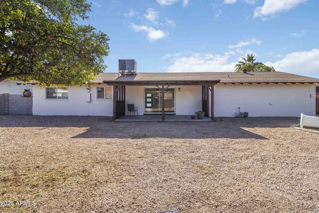 224 N 58th St, Mesa, AZ 85205 - back of house featuring a patio, central AC, and stucco siding