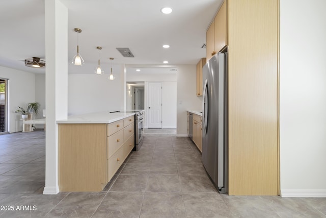 224 N 58th St, Mesa, AZ 85205 - kitchen with appliances with stainless steel finishes, light brown cabinetry, light countertops, hanging light fixtures, and recessed lighting