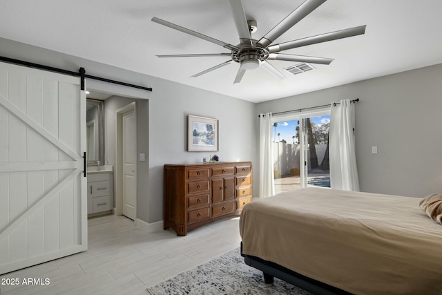 bedroom with wood finish floors, visible vents, a barn door, a ceiling fan, and access to outside