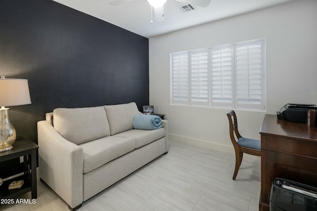 home office featuring a ceiling fan, visible vents, and baseboards