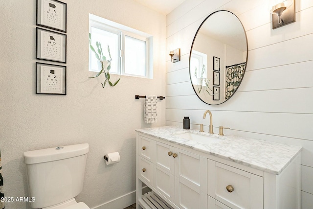 full bathroom featuring vanity and toilet