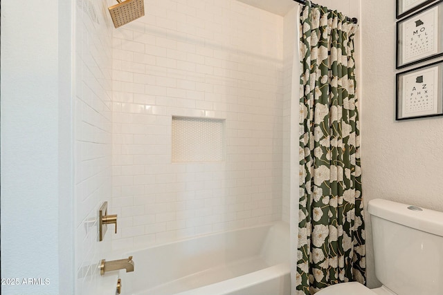 full bathroom with toilet, shower / tub combo with curtain, and a textured wall