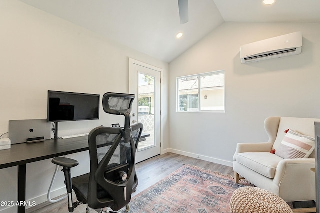 office with lofted ceiling, recessed lighting, light wood-style flooring, an AC wall unit, and baseboards