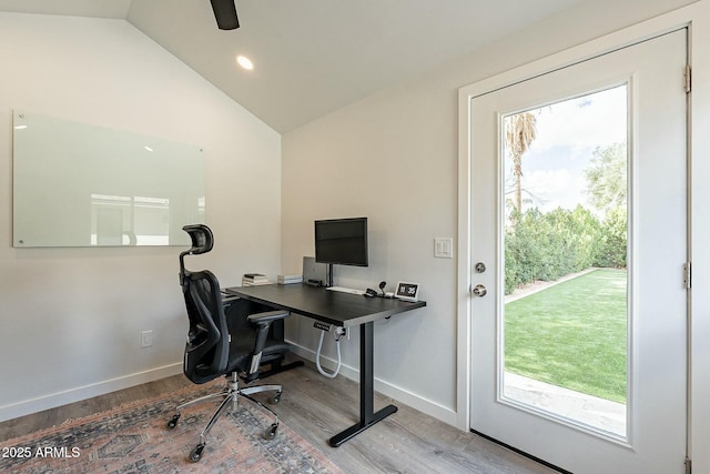 office space featuring lofted ceiling, recessed lighting, wood finished floors, and baseboards