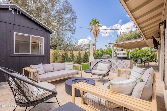 view of patio / terrace featuring fence and an outdoor living space