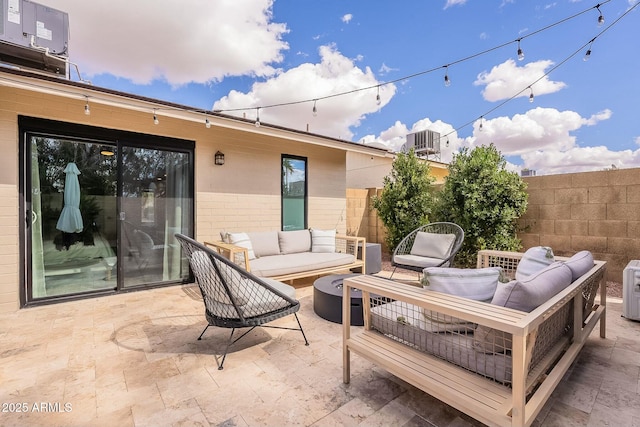 view of patio / terrace with ac unit, cooling unit, fence, and an outdoor hangout area