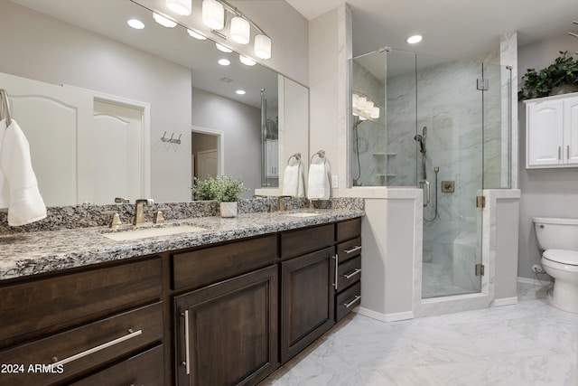 bathroom with a shower with shower door, tile patterned floors, dual vanity, and toilet