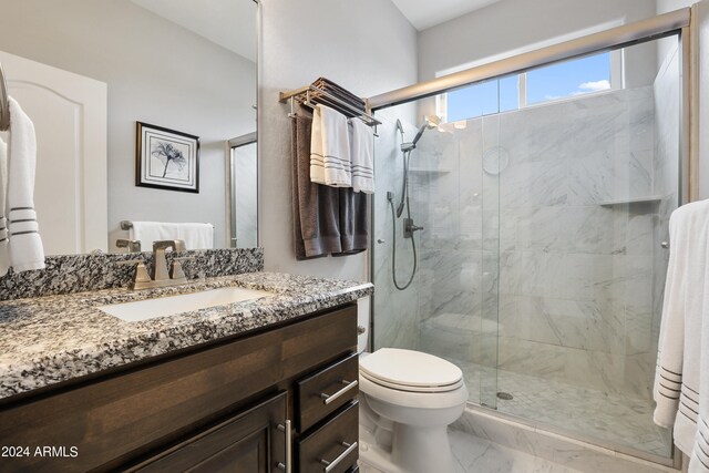 bathroom with toilet, tile patterned floors, vanity, and an enclosed shower