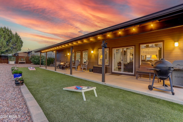 exterior space featuring a patio area and a yard