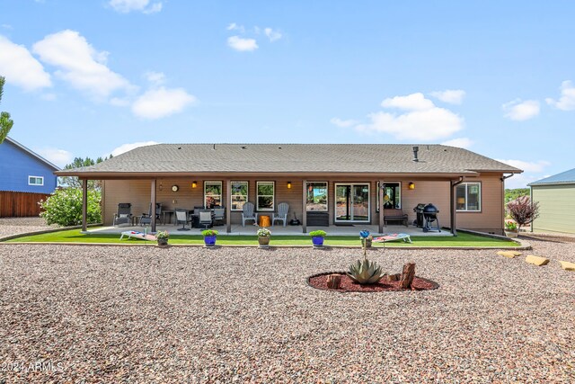 back of property featuring a patio area