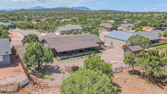 birds eye view of property featuring a mountain view