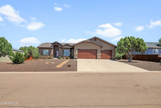 single story home with a garage