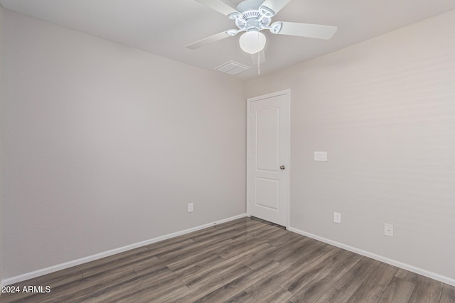 empty room featuring dark hardwood / wood-style floors and ceiling fan