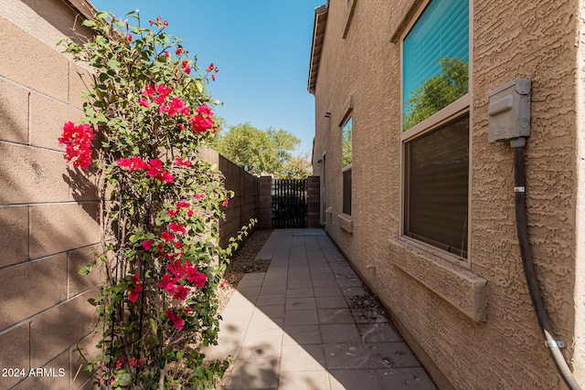 view of side of property featuring a patio area