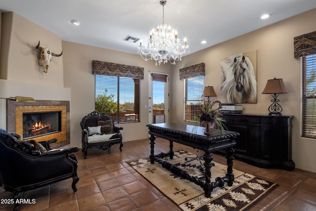 office space with recessed lighting, visible vents, an inviting chandelier, and a tiled fireplace