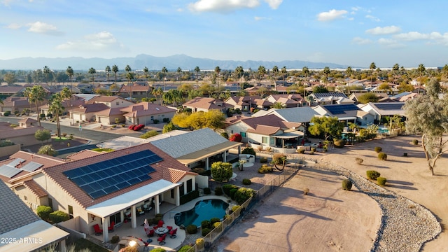 birds eye view of property with a mountain view