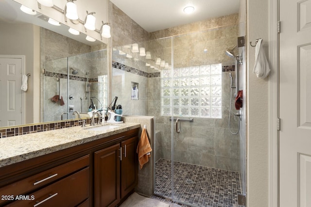 bathroom with vanity and walk in shower