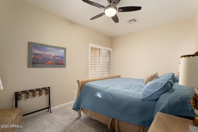 bedroom featuring ceiling fan and light carpet